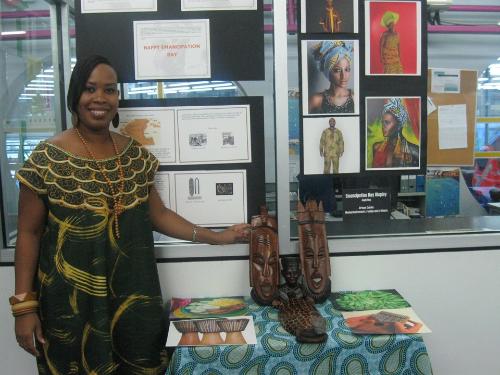   SBCS library staff poses with the  Emancipation Day display at the San Fernando campus